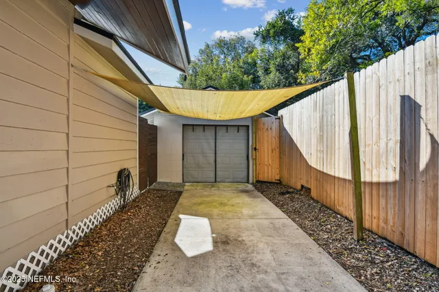 a front view of house with yard and outdoor seating