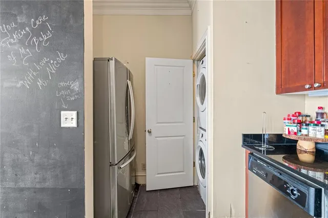a kitchen with a refrigerator and cabinets