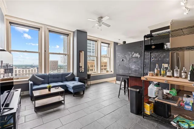a living room with furniture and a large window
