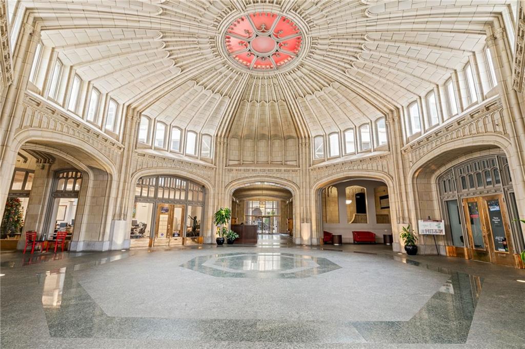 57 Forsyth Street Northwest, Unit 14H Atlanta, GA 30303 - Photo 25 of 42 a view of a large building with a balcony