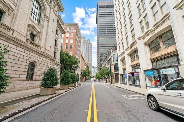 a view of a building with car parked