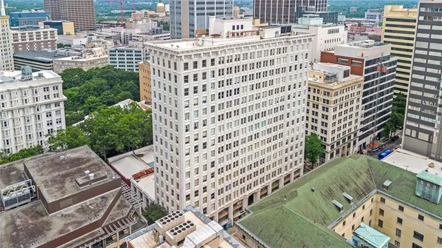 a view of a building with a yard