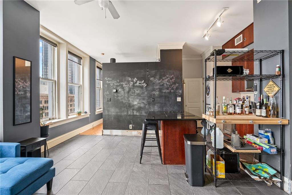 57 Forsyth Street Northwest, Unit 14H Atlanta, GA 30303 - Photo 4 of 42 a living room filled with furniture