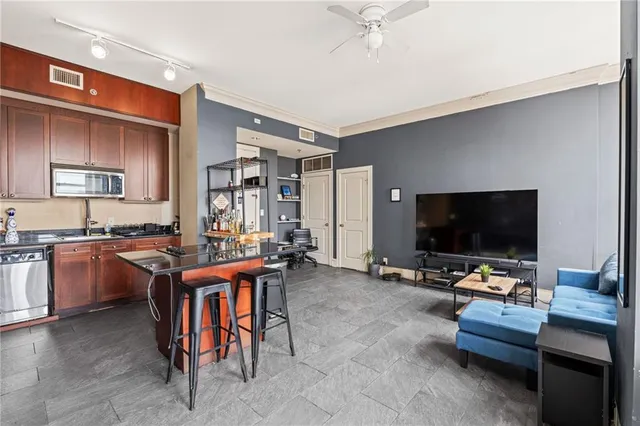 a living room with furniture and a flat screen tv