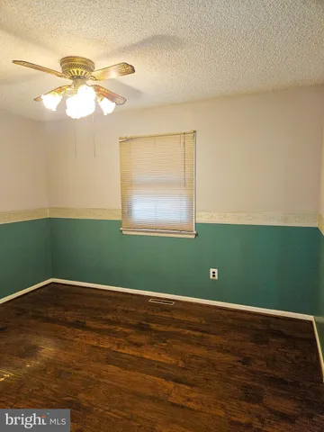 a kitchen with a sink a window and cabinets