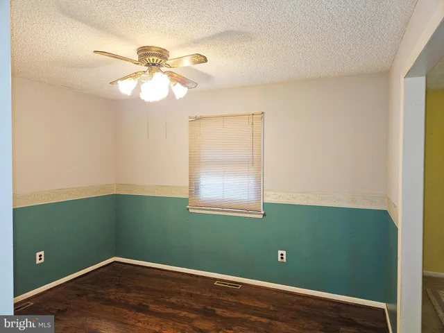 a kitchen with a sink a stove and a window