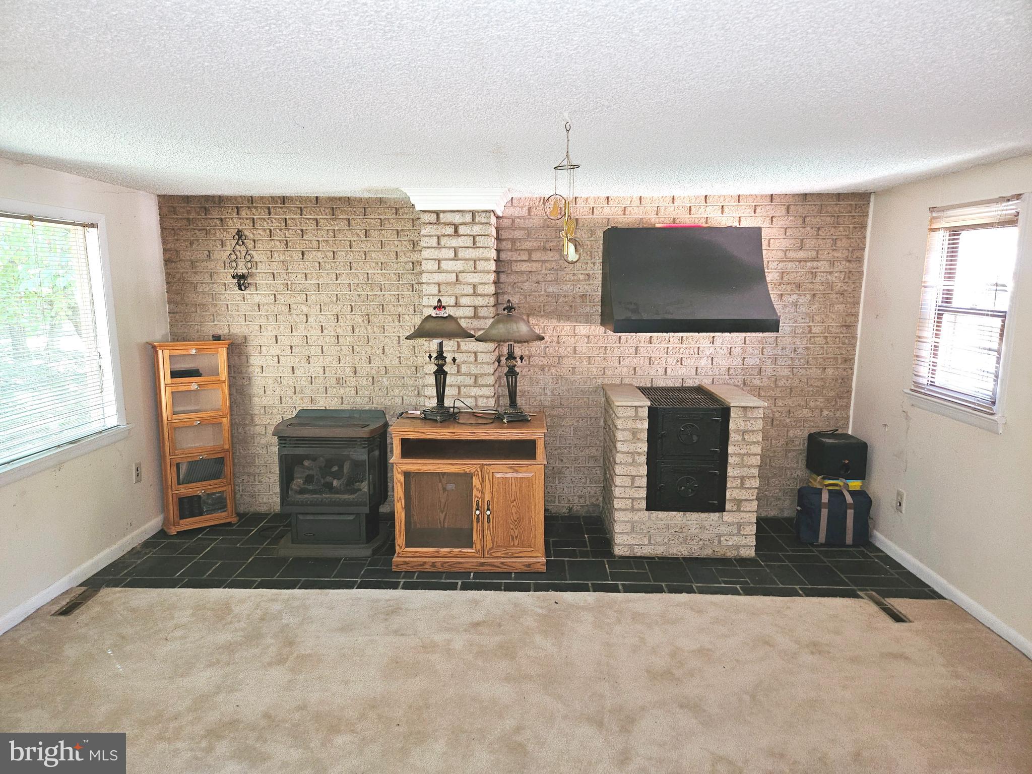 117 Maple Avenue Waterford Works, NJ 08089 - Photo 26 of 67 a living room with furniture a flat screen tv and a fireplace