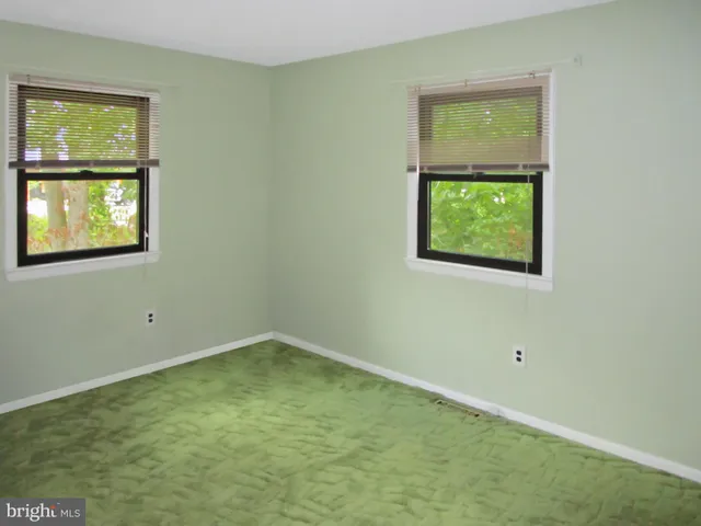 a backyard of a house with outdoor seating