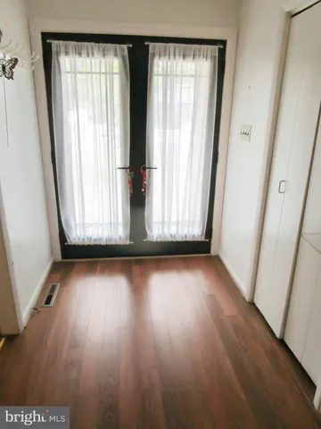 a view of a livingroom with wooden floor