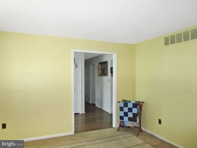 a view of a room with window and wooden floor