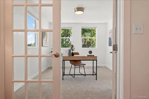 a work room with furniture and a window
