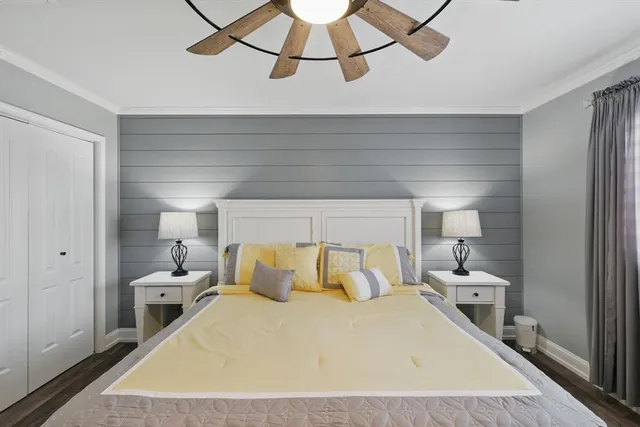 a bedroom with a bed and a mirror