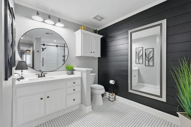 a bathroom with a double vanity sink and a mirror