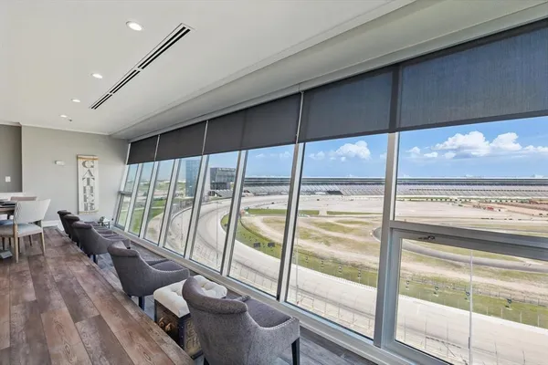 a view of a living room and floor to ceiling window or wooden floor