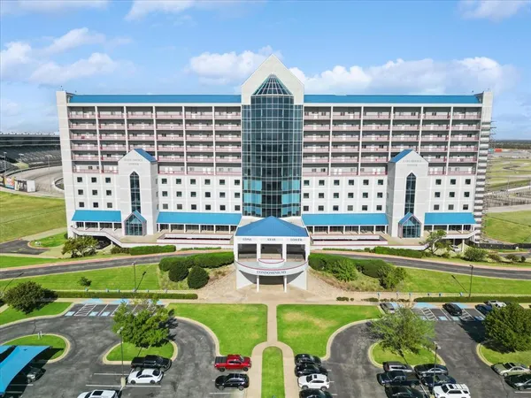 a front view of a building with garden