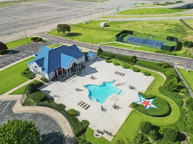 a view of a swimming pool with a garden and plants