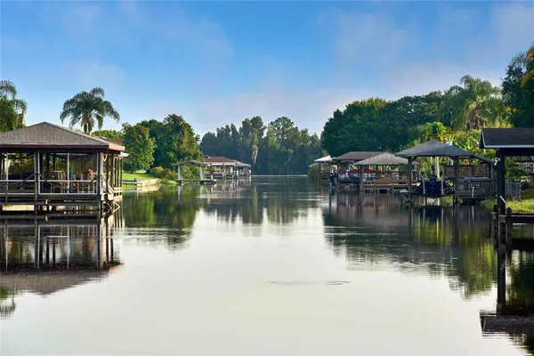 a view of a lake with a house in the background