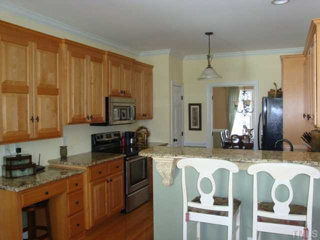 2845 Anfield Road Raleigh, NC 27606 - Photo 7 of 25 Full View of Kitchen with Breakfast Bar