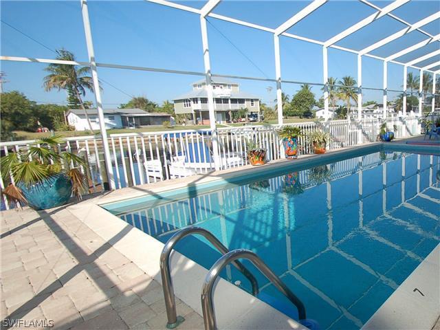 3215 Stringfellow Road, Unit 205 St. James City, FL 33956 - Photo 8 of 11 a view of a balcony dining area