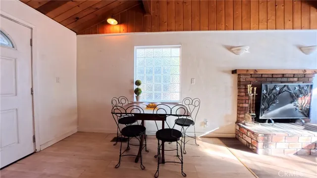 a dining room with furniture and a fireplace
