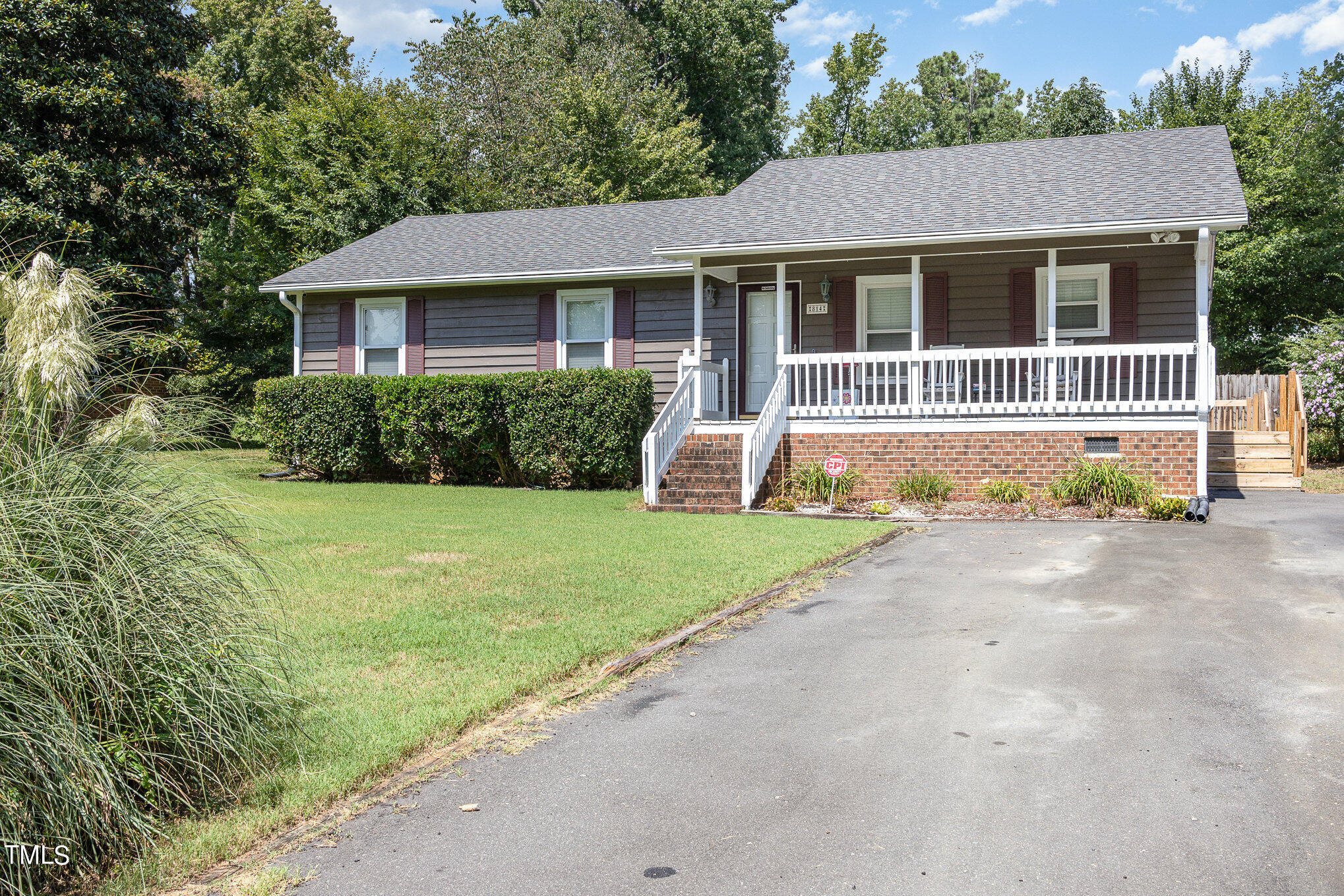 814 Wyldewood Road Durham, NC 27704 - Photo 1 of 26 a front view of a house with a yard and garage