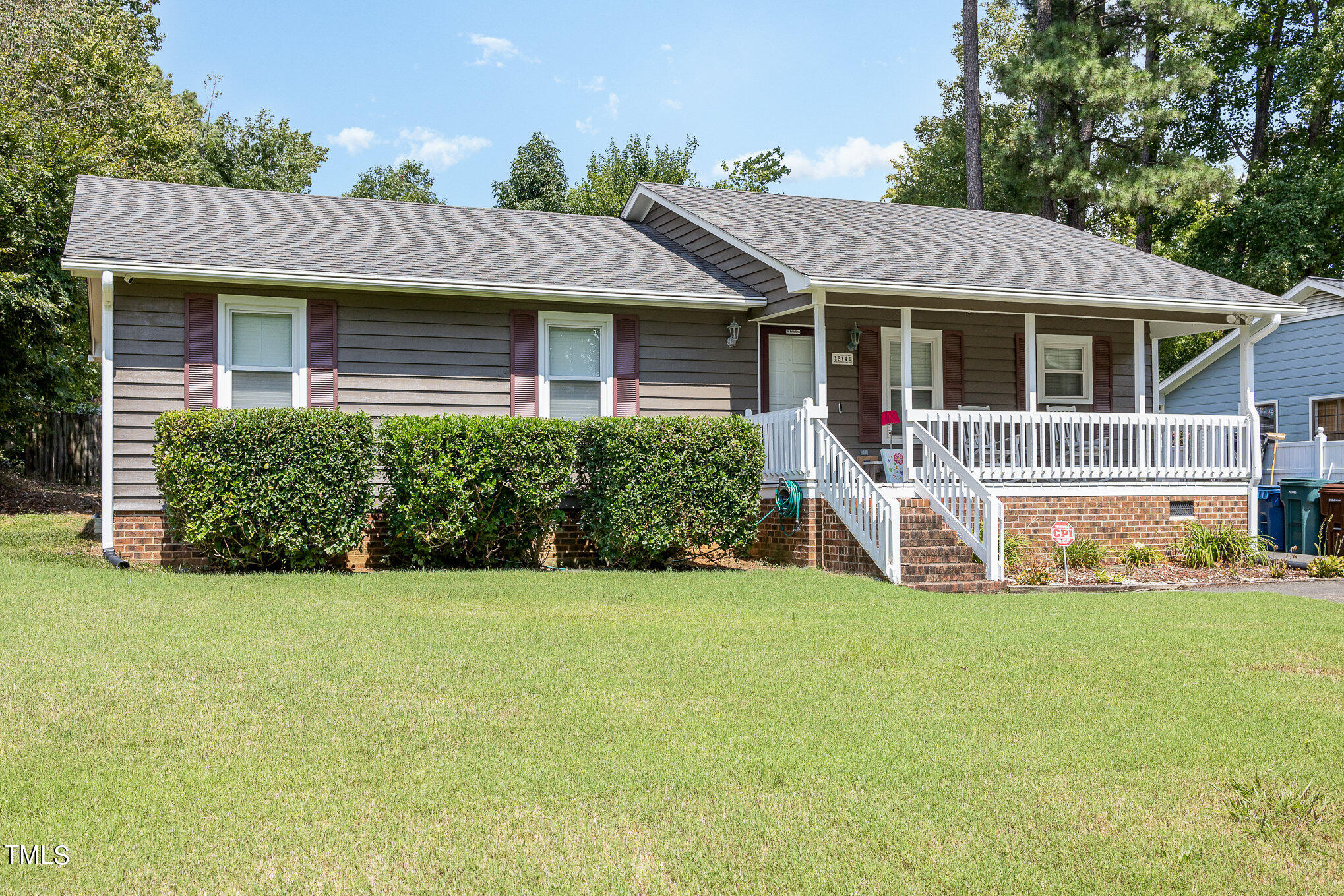 814 Wyldewood Road Durham, NC 27704 - Photo 2 of 26 a front view of a house with yard and green space