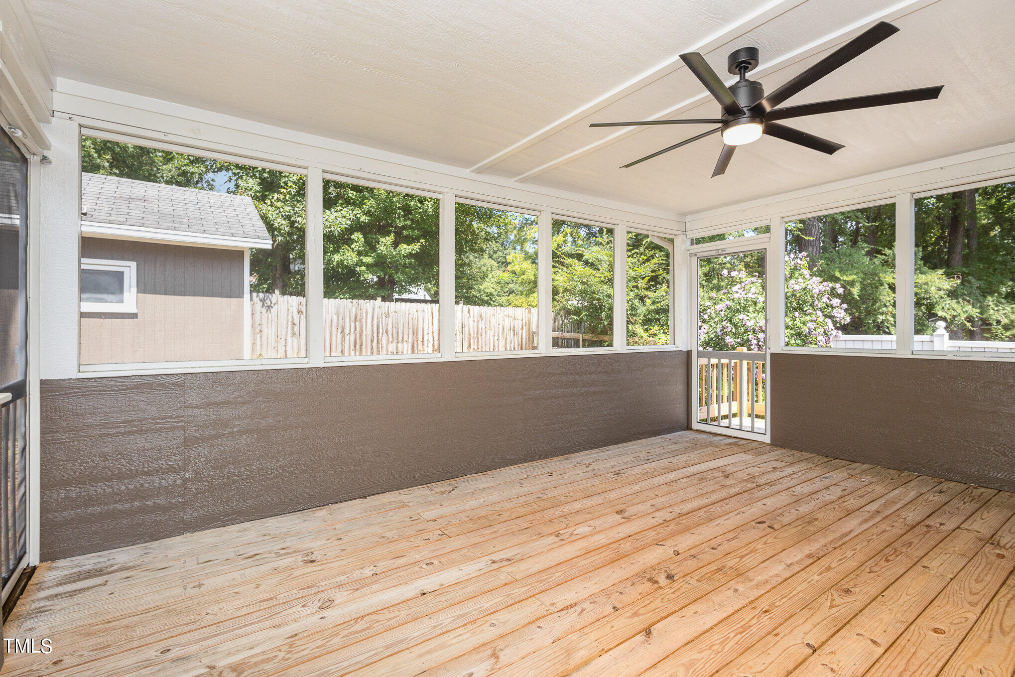 814 Wyldewood Road Durham, NC 27704 - Photo 21 of 26 a view of an empty room with wooden floor and a window
