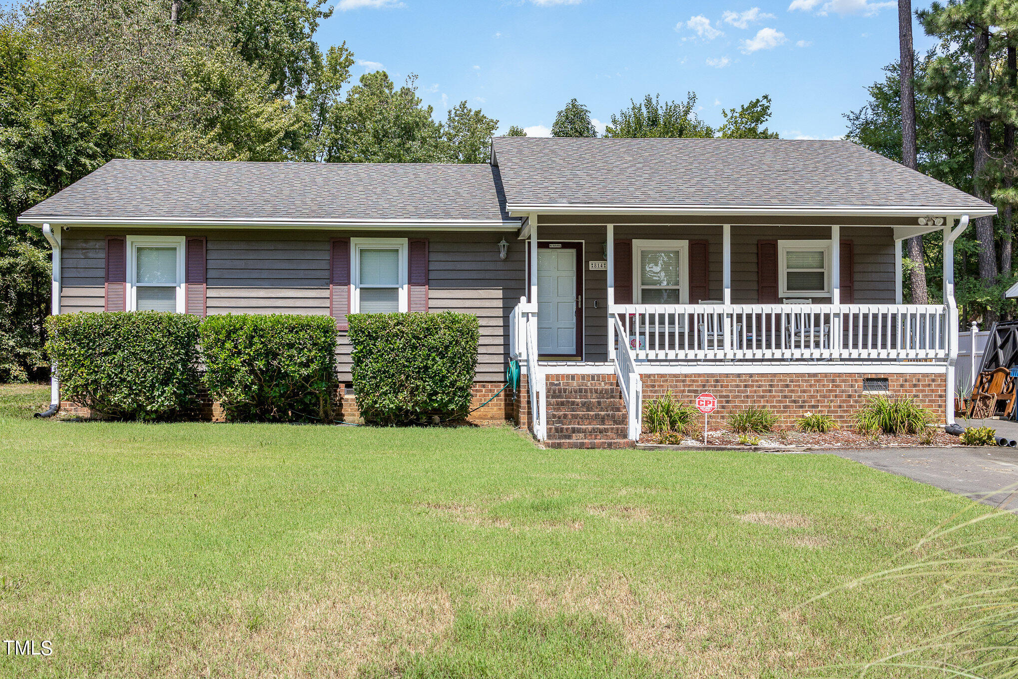 814 Wyldewood Road Durham, NC 27704 - Photo 3 of 26 a front view of a house with a garden