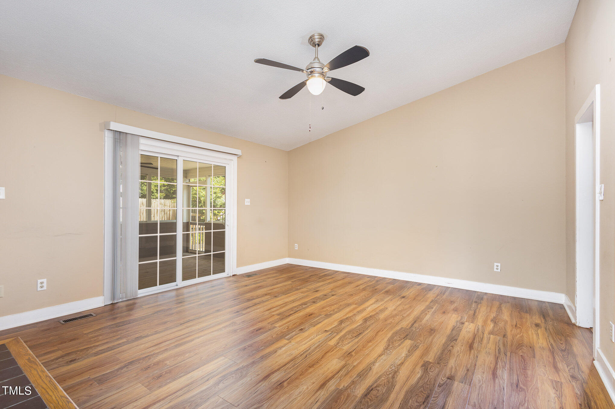 814 Wyldewood Road Durham, NC 27704 - Photo 5 of 26 wooden floor in an empty room with a window