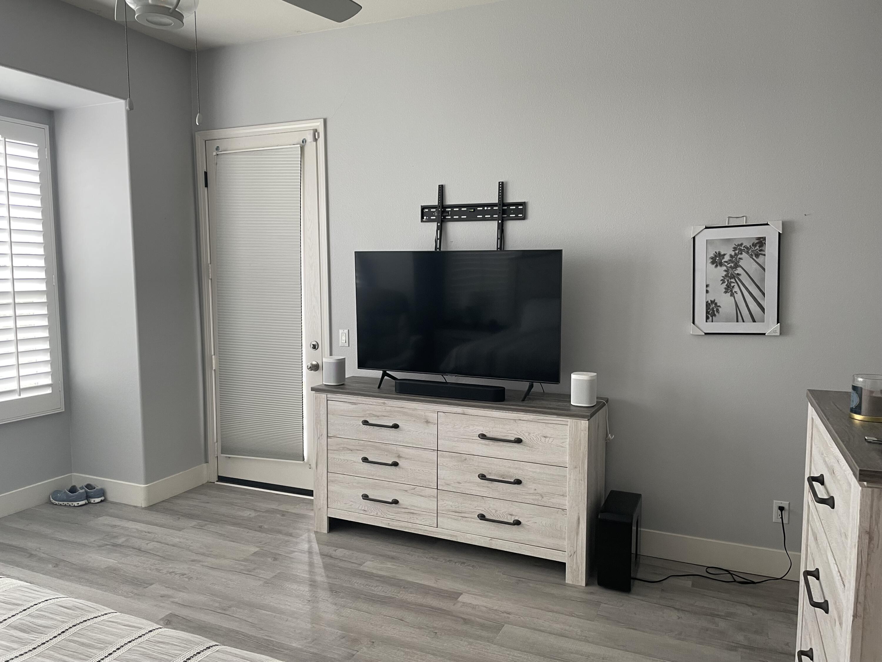 61232 Cactus Spring Drive La Quinta, CA 92253 - Photo 16 of 30 a room with furniture and flat screen tv