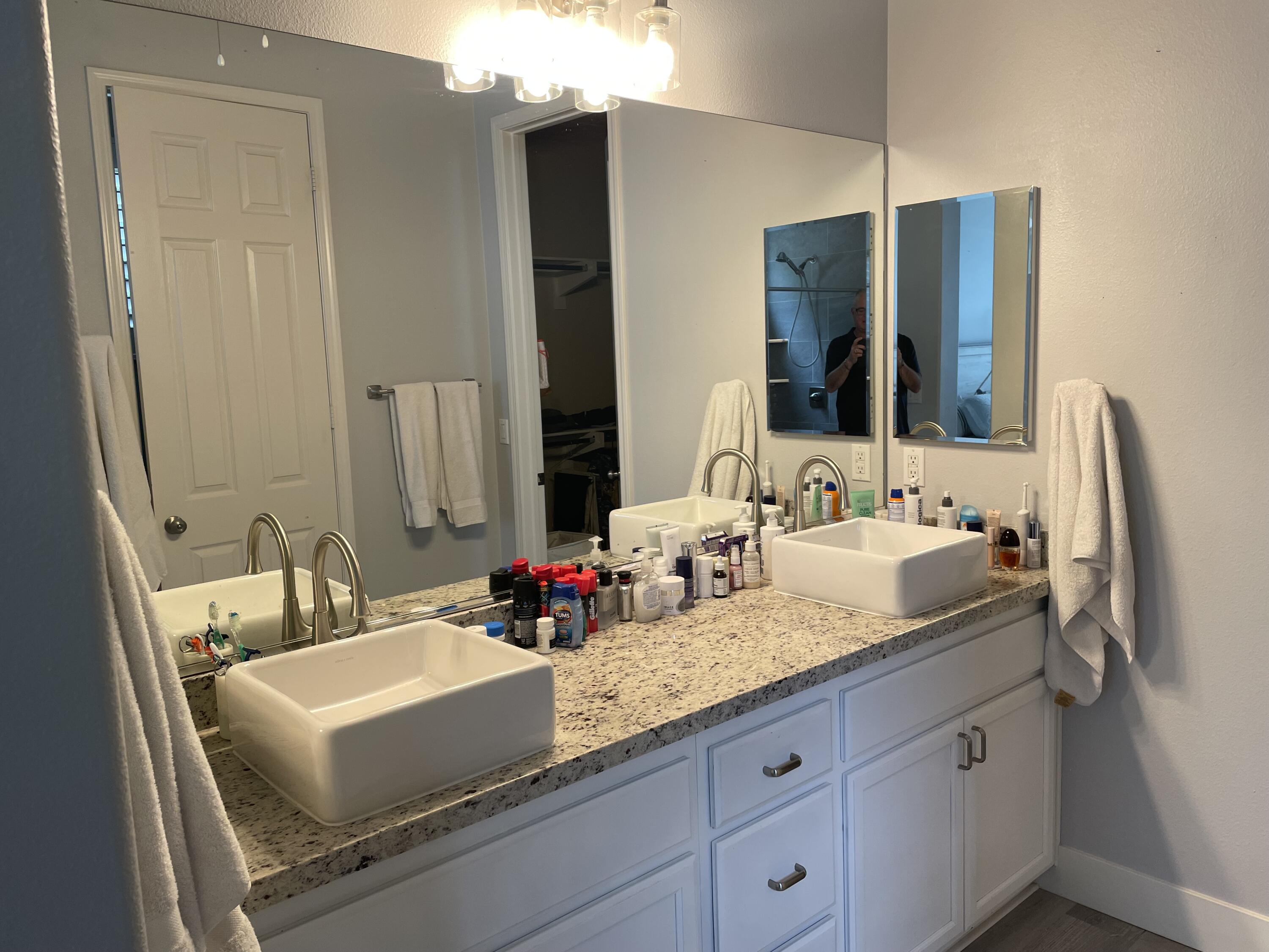 61232 Cactus Spring Drive La Quinta, CA 92253 - Photo 17 of 30 a bathroom with a granite countertop double vanity sink and mirror