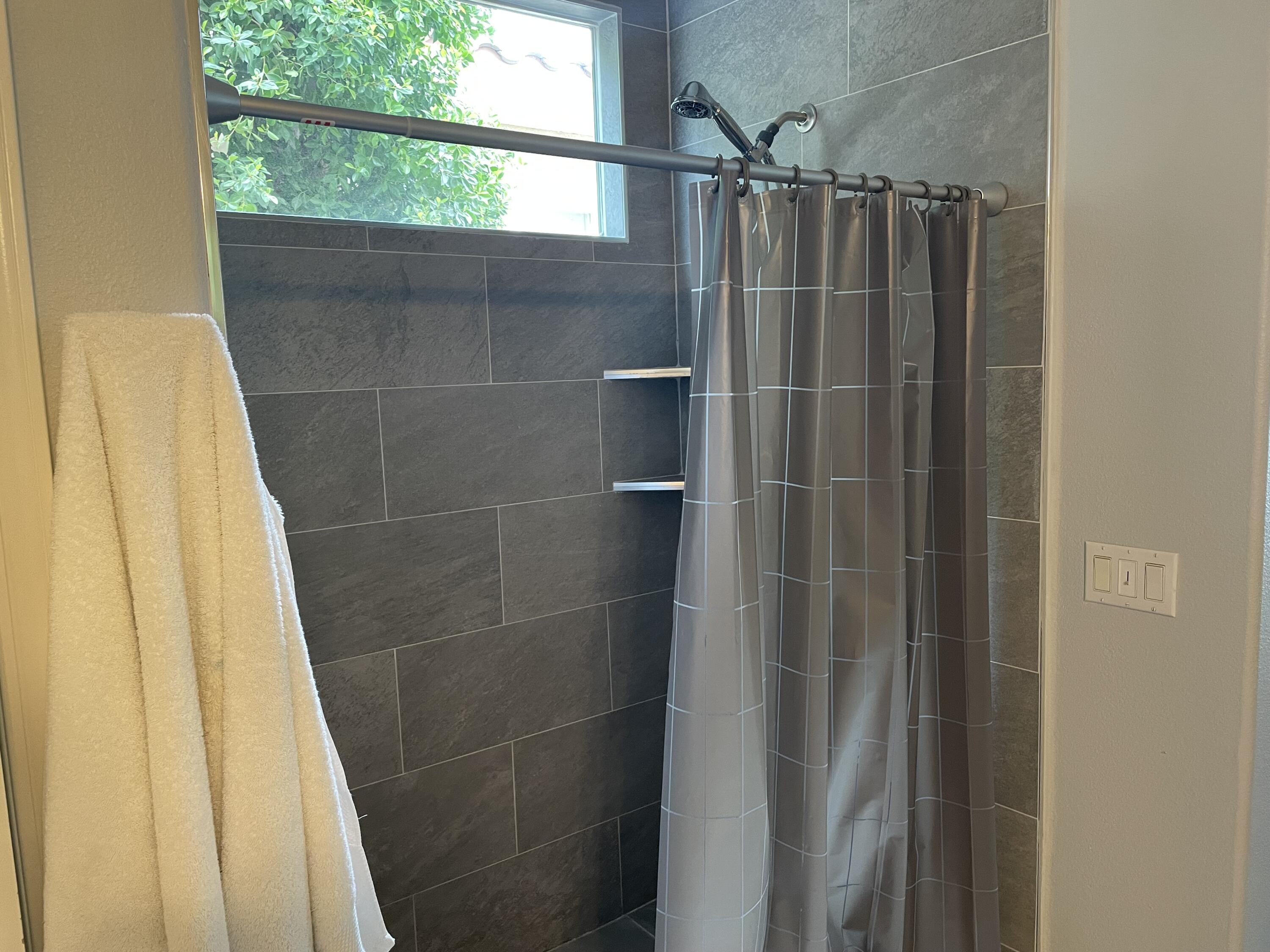 61232 Cactus Spring Drive La Quinta, CA 92253 - Photo 20 of 30 a bathroom with a shower and a glass door