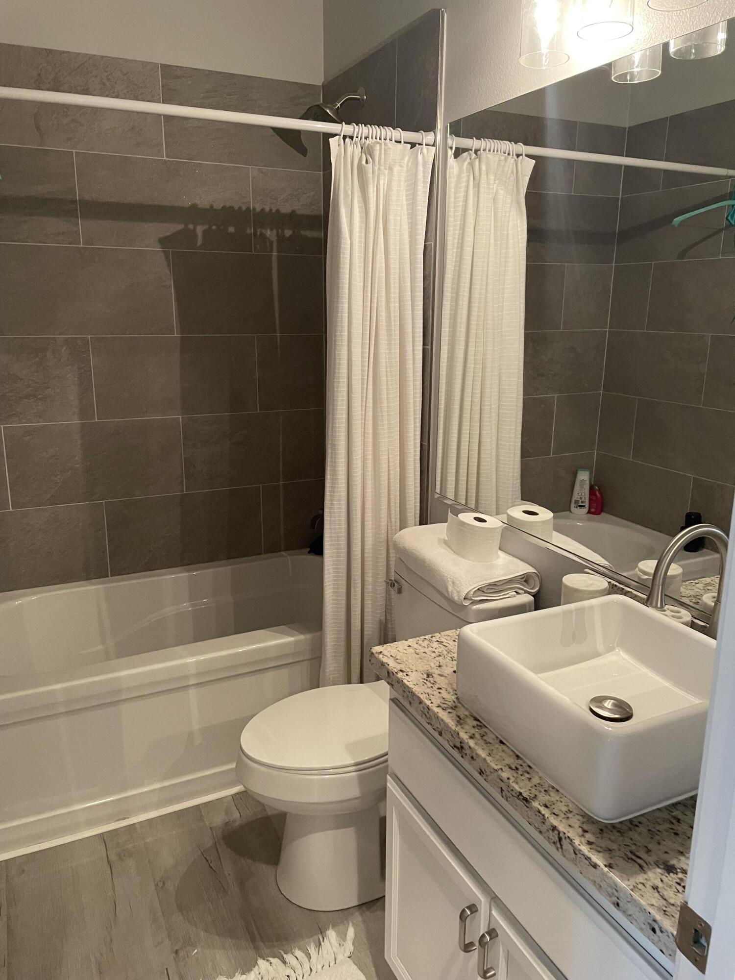 61232 Cactus Spring Drive La Quinta, CA 92253 - Photo 22 of 30 a bathroom with a sink toilet and shower