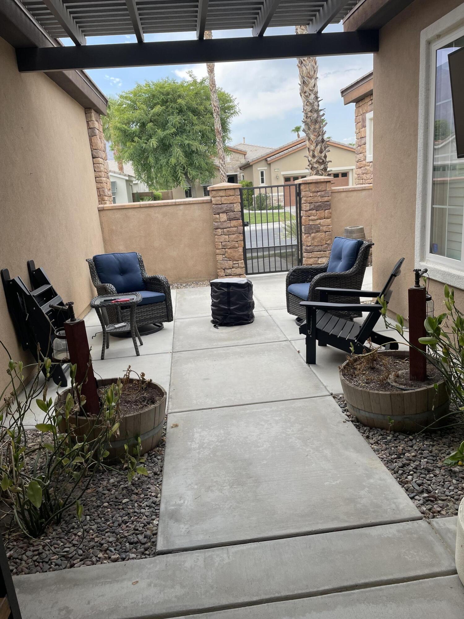 61232 Cactus Spring Drive La Quinta, CA 92253 - Photo 27 of 30 a living room with furniture and a window