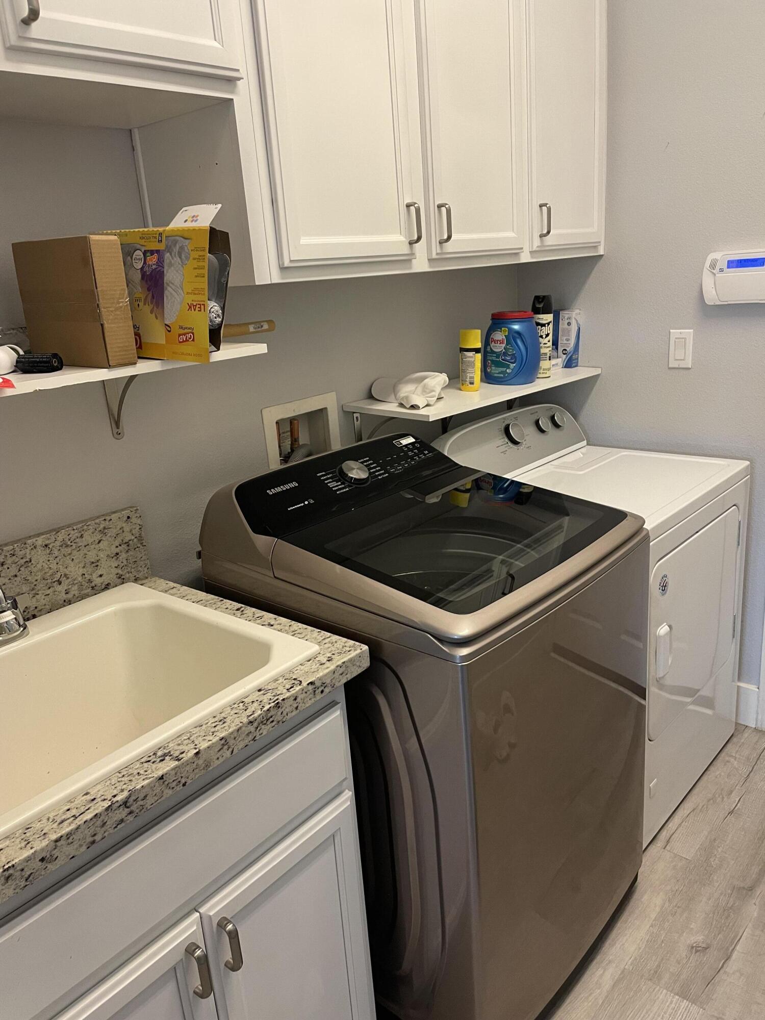 61232 Cactus Spring Drive La Quinta, CA 92253 - Photo 30 of 30 a kitchen with a sink and cabinets