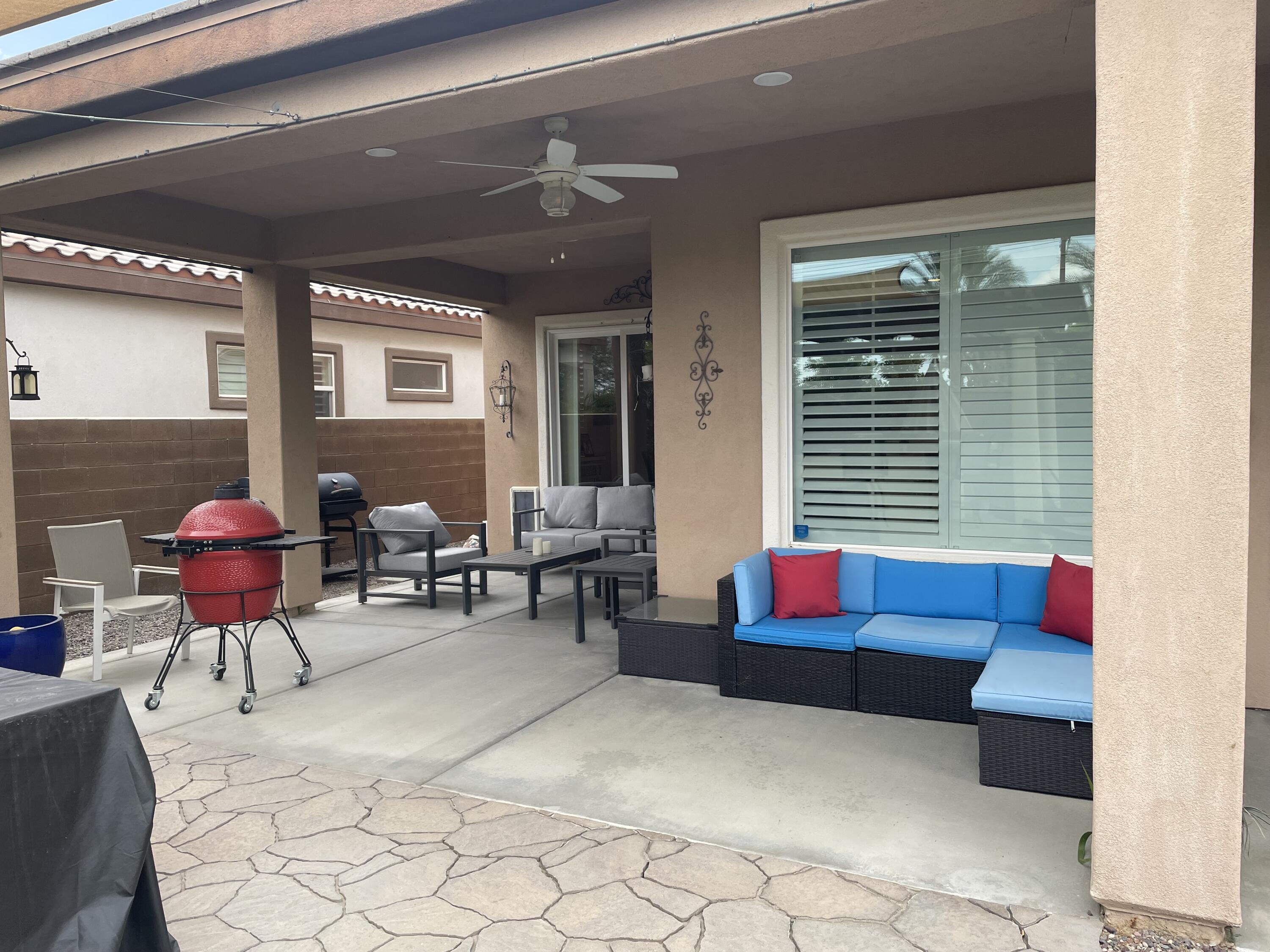 61232 Cactus Spring Drive La Quinta, CA 92253 - Photo 9 of 30 a living room with furniture and a large window