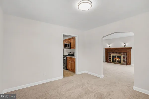 an empty room with fireplace