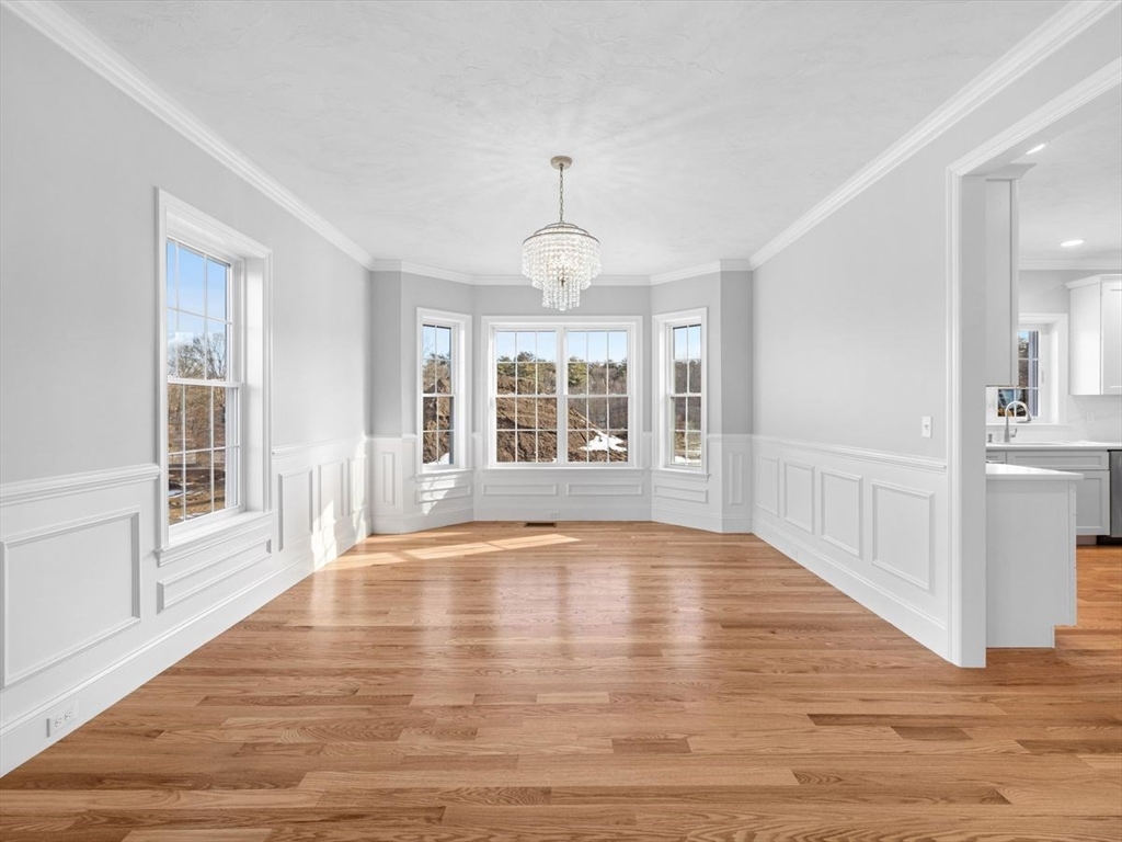 46 Lackey Street Westborough, MA 01581 - Photo 11 of 42 a view of an empty room with wooden floor and a window