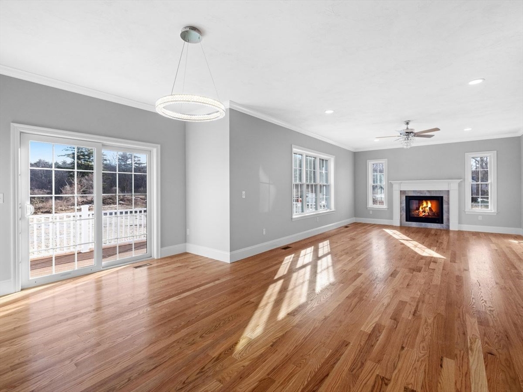 46 Lackey Street Westborough, MA 01581 - Photo 18 of 42 a view of empty room with wooden floor and fireplace