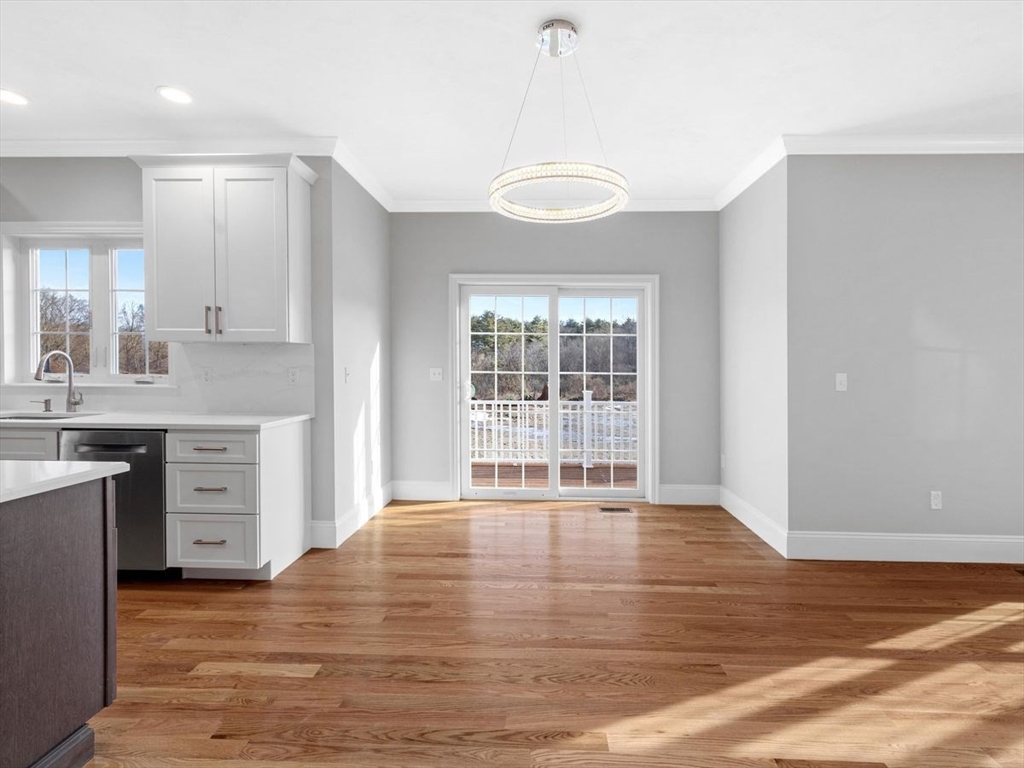 46 Lackey Street Westborough, MA 01581 - Photo 19 of 42 a view of an empty room with window and wooden floor