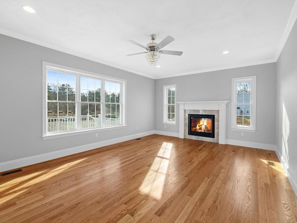 46 Lackey Street Westborough, MA 01581 - Photo 21 of 42 a view of empty room with wooden floor and fan