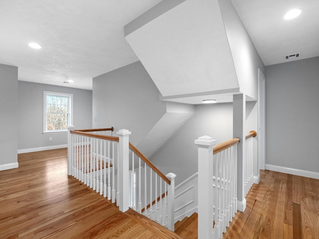 46 Lackey Street Westborough, MA 01581 - Photo 23 of 42 a view of a hallway with windows and stairs