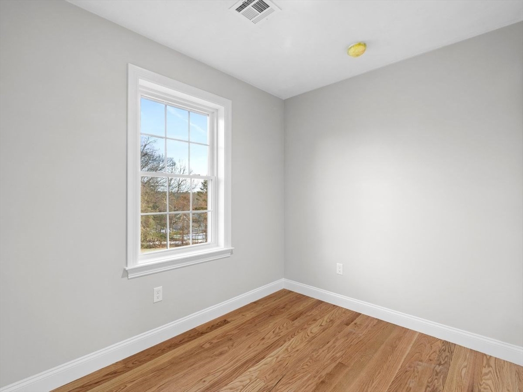 46 Lackey Street Westborough, MA 01581 - Photo 24 of 42 an empty room with wooden floor and windows