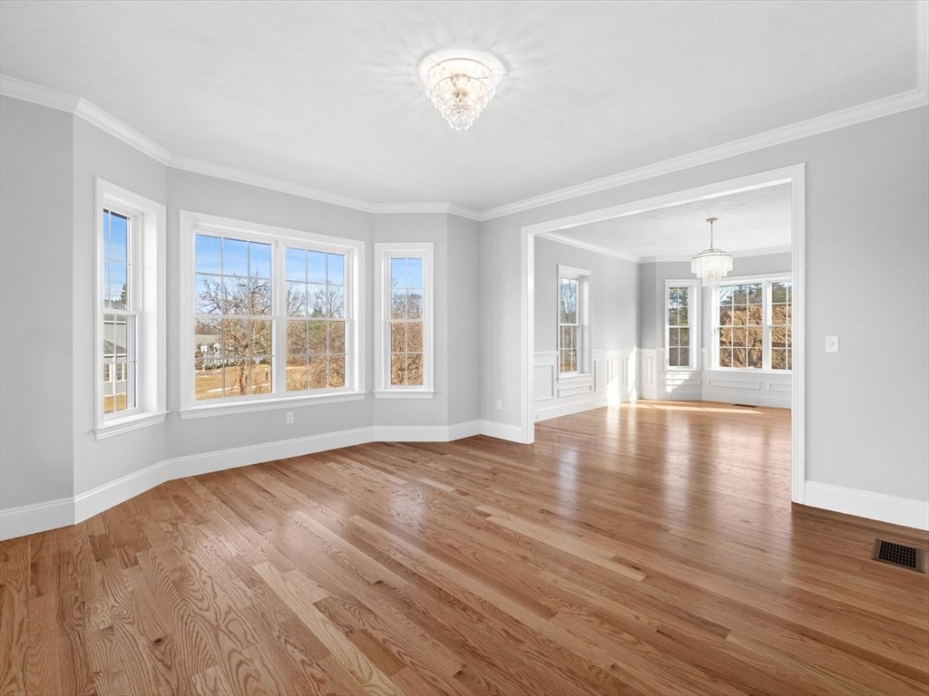 46 Lackey Street Westborough, MA 01581 - Photo 8 of 42 a view of an empty room with window and wooden floor
