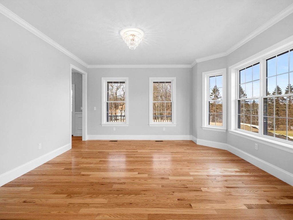 46 Lackey Street Westborough, MA 01581 - Photo 10 of 42 a view of an empty room with wooden floor and a window