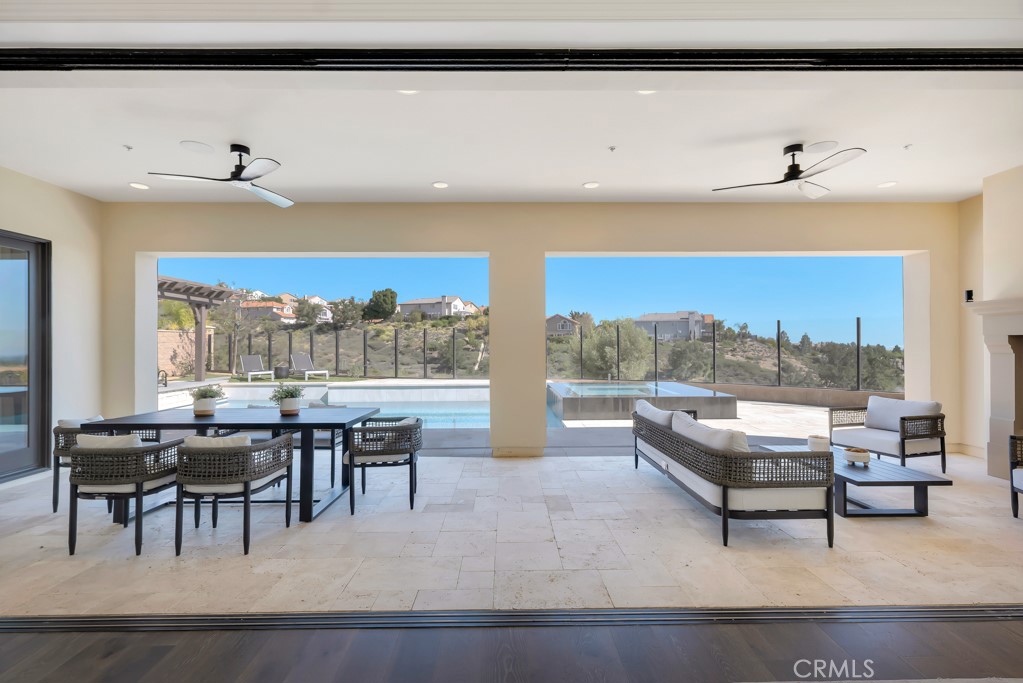 20120 Jubilee Way Porter Ranch, CA 91326 - Photo 14 of 55 a living room with furniture a table and chairs