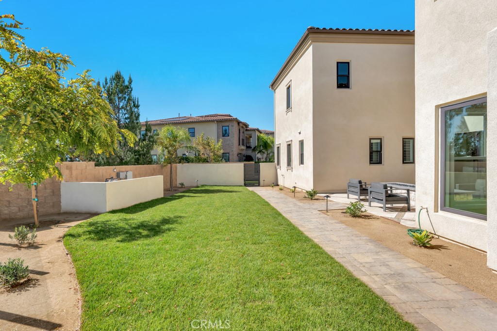 20120 Jubilee Way Porter Ranch, CA 91326 - Photo 24 of 55 a front view of a house with garden