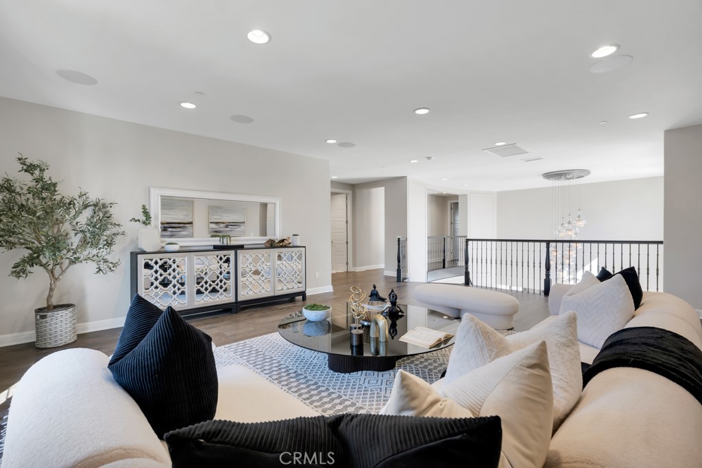 20120 Jubilee Way Porter Ranch, CA 91326 - Photo 26 of 55 a living room with furniture and wooden floor