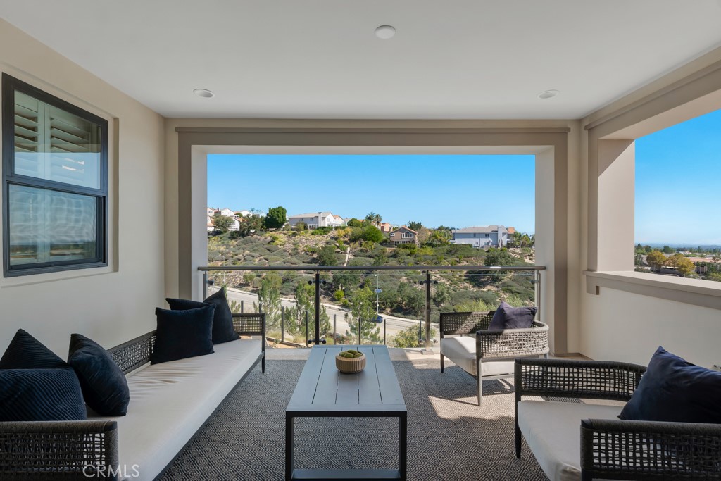 20120 Jubilee Way Porter Ranch, CA 91326 - Photo 30 of 55 a living room with furniture and a floor to ceiling window