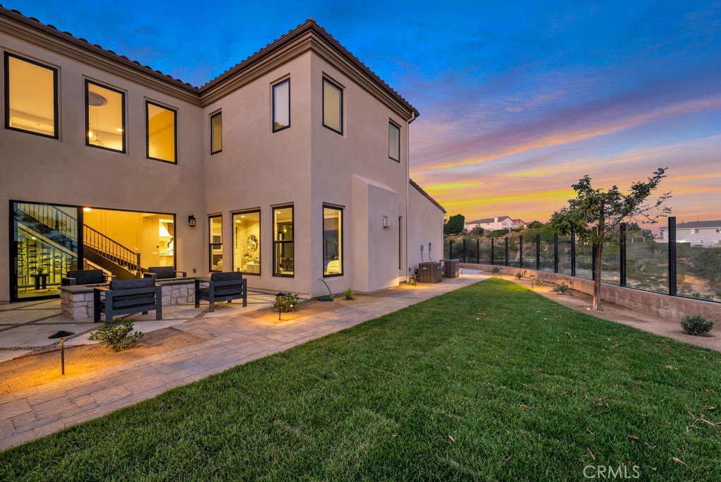 20120 Jubilee Way Porter Ranch, CA 91326 - Photo 52 of 55 a view of a house with backyard porch and sitting area